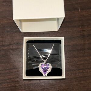 I’m selling a Purple Heart necklace with small diamonds surrounding.